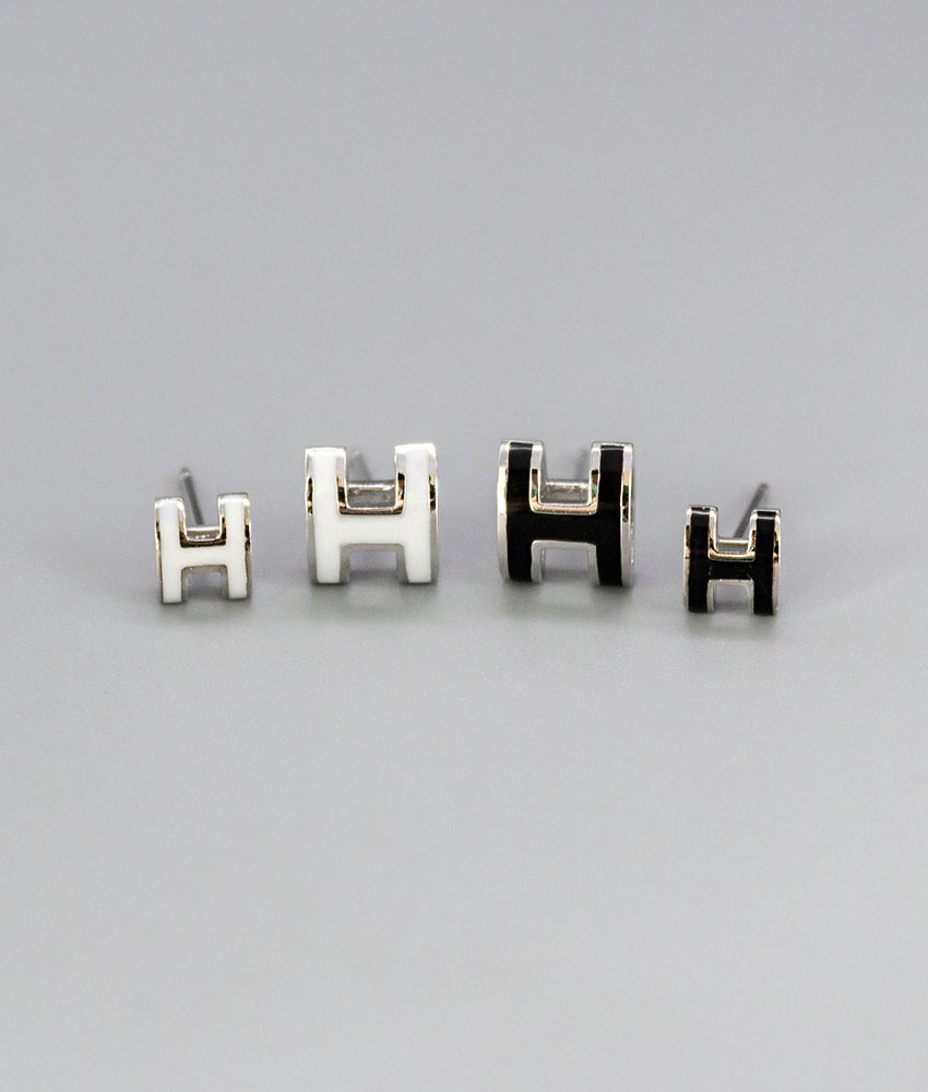 H initials. Silver needle earrings.